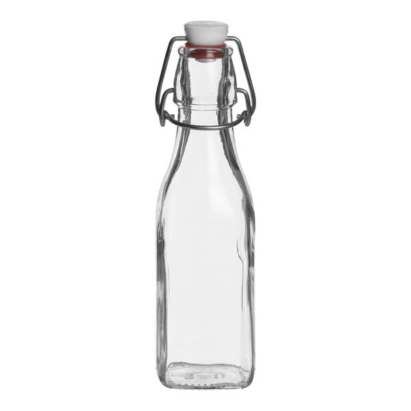 A Bormioli Rocco Swing Top clear glass bottle with a white cap.