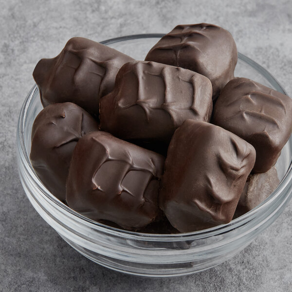 A bowl of Albanese dark chocolate covered peanut butter meltaways.