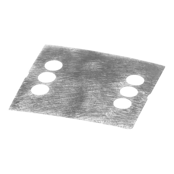 A silver metal shim with four holes.