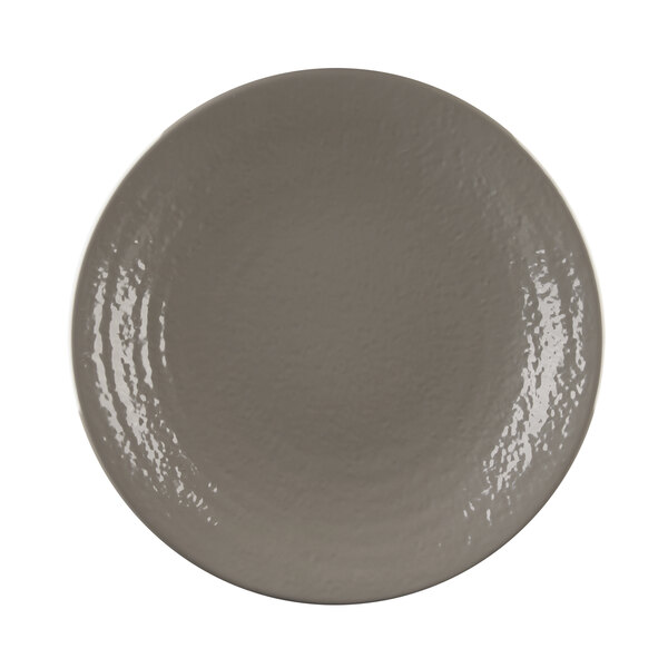 A close-up of a mushroom-colored Elite Global Solutions round plate.