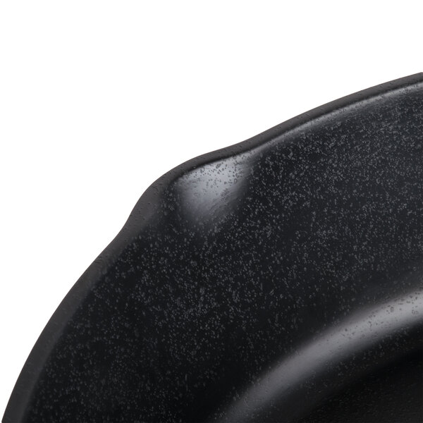 A black Elite Global Solutions faux cast iron fry pan on a counter.