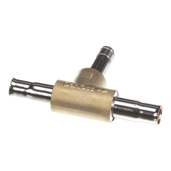 A close-up of an Ice-O-Matic solenoid valve kit with brass and metal parts.