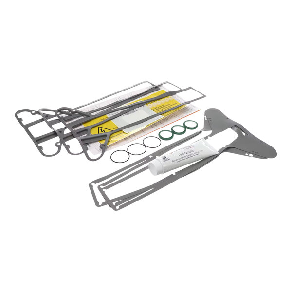 A service kit for Garland/US Range ME/G-3Px grills, including gaskets, O-rings, a tube of grease, and various metal components.