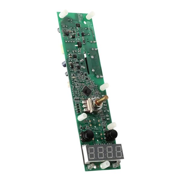 A green circuit board with a digital display and gold knob.