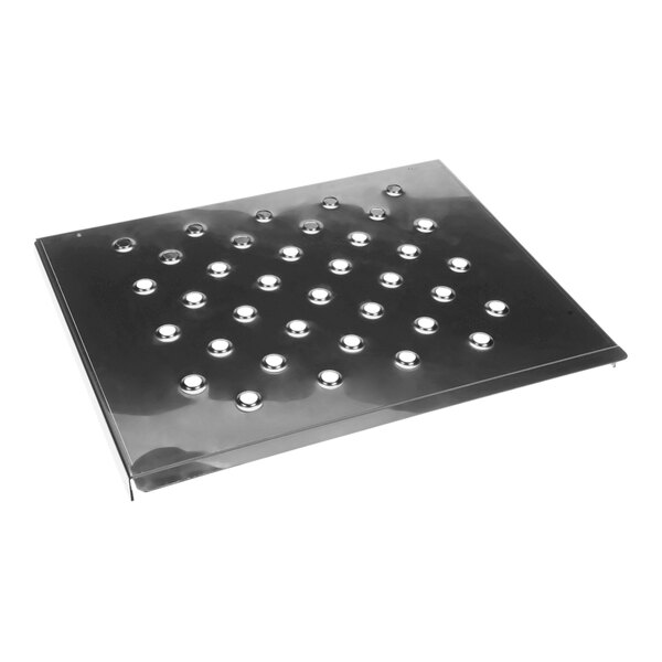 A metal plate with many small round holes.