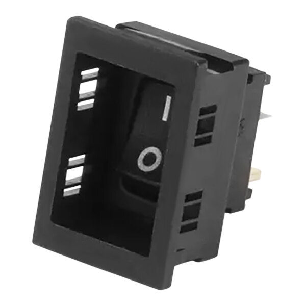 A black rectangular Follett Corporation rocker switch with a hole in the middle.