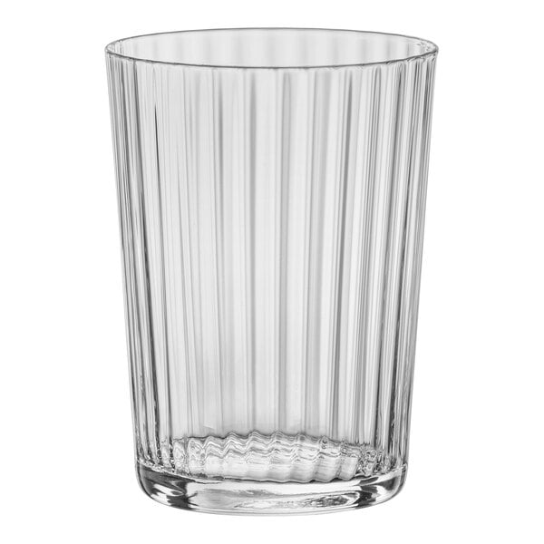 A clear glass tumbler with a ribbed rim.