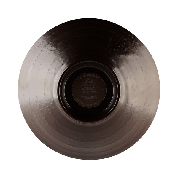 A tapenade-colored melamine bowl with a pebble texture and a black disc with a circle in the middle.