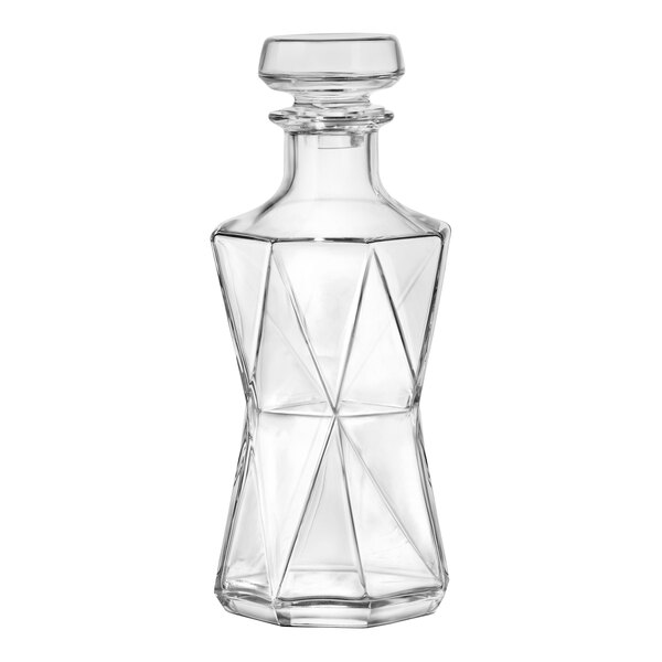 A clear glass Bormioli Rocco Cassiopea decanter with a geometric design.