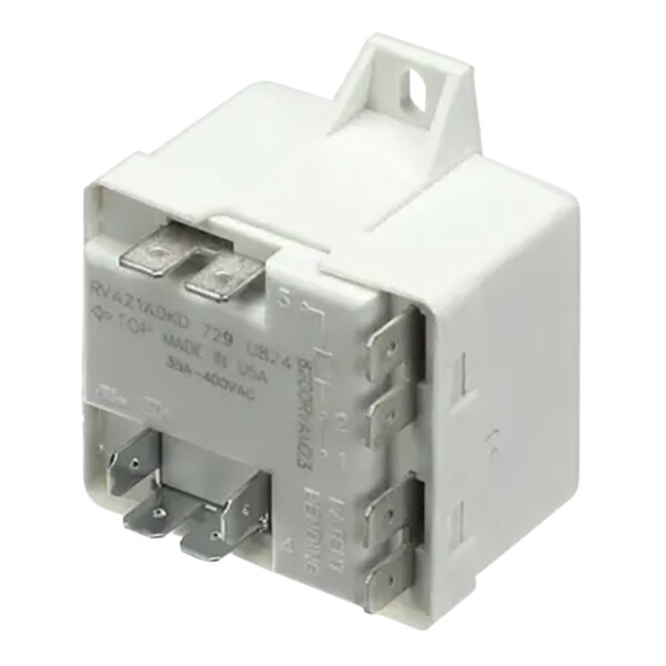 A white Follett Corporation relay with metal terminals.