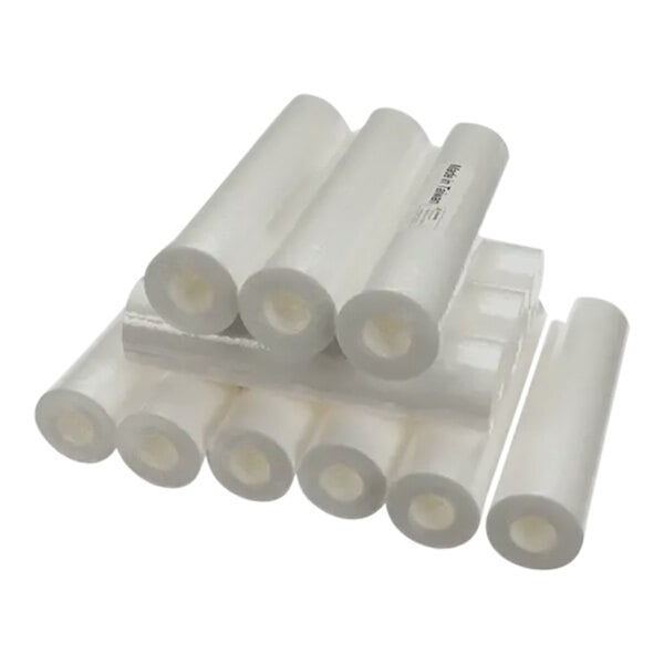 A stack of white plastic water filter cartridges.