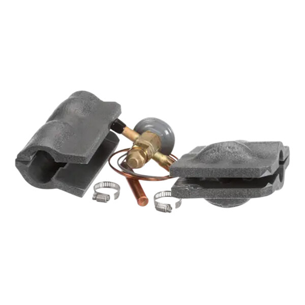 A black and grey Follett Corporation valve for plumbing.