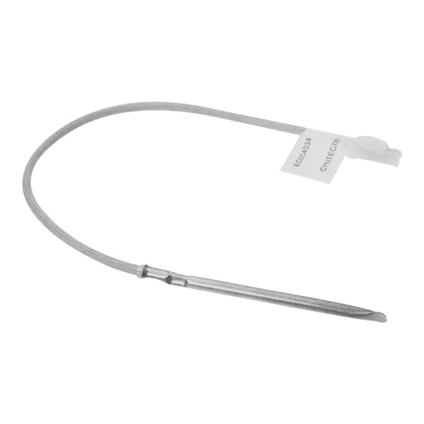 A long thin metal tube with a white label and a wire.