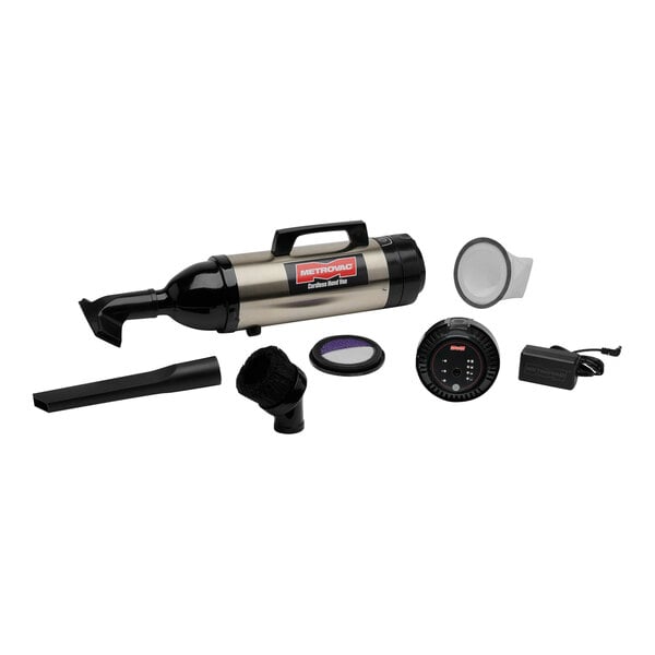 A MetroVac stainless steel handheld vacuum cleaner with accessories.