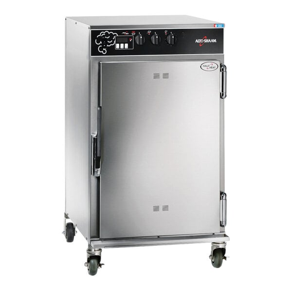 A stainless steel Alto Shaam Low-Temperature Cook and Hold Smoker Oven with wheels.