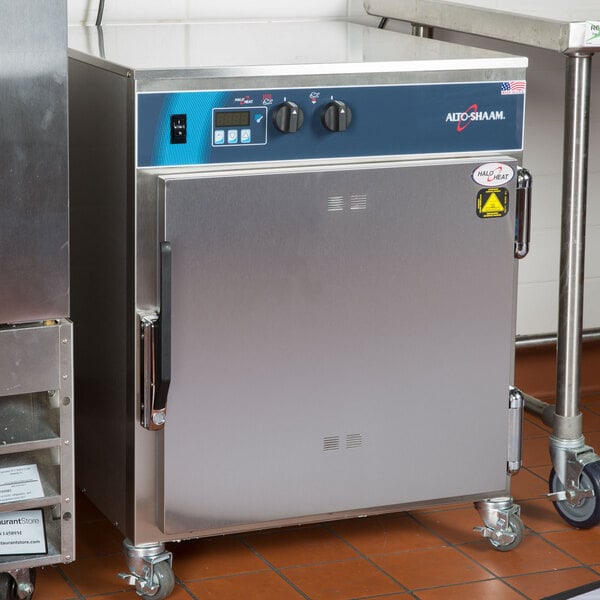 An Alto-Shaam undercounter cook and hold oven on a metal table.