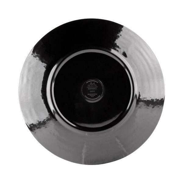 A black plate with a silver rim.