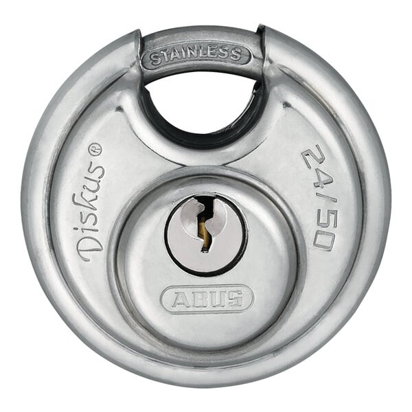 A close up of a stainless steel ABUS padlock with a key in it.