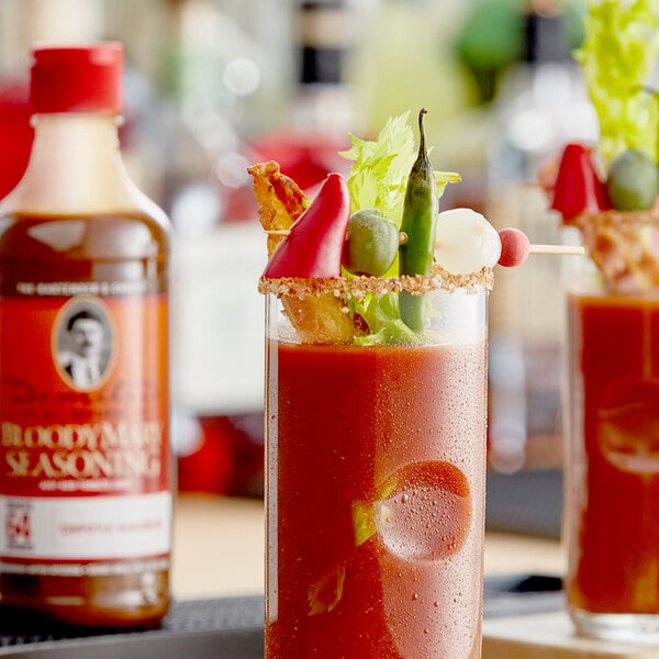 A table with a Bloody Mary garnish and a bottle of Demitri's Chipotle-Habanero Bloody Mary Concentrated Seasoning.