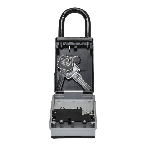 A black ABUS KeyGarage lockbox with keys inside.