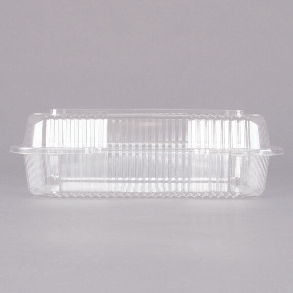 A Dart clear plastic container with a high dome lid.