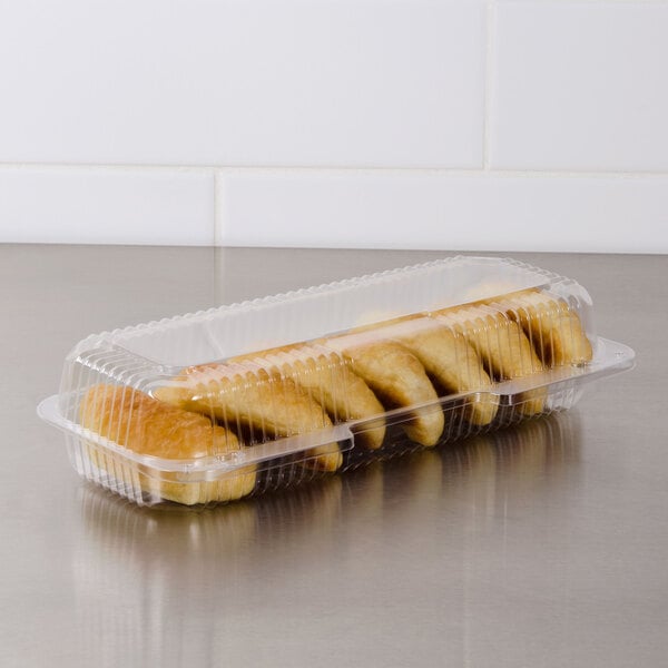 A Dart clear plastic container of strudel.