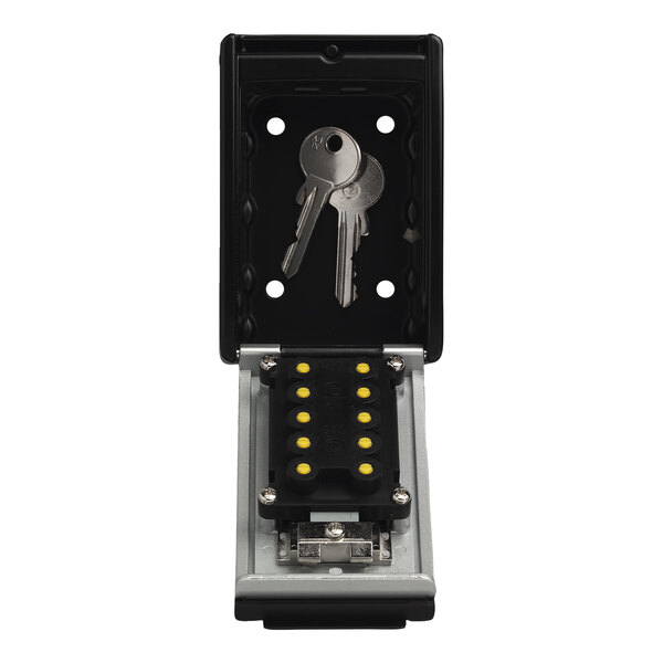 A key in a black ABUS KeyGarage lockbox.
