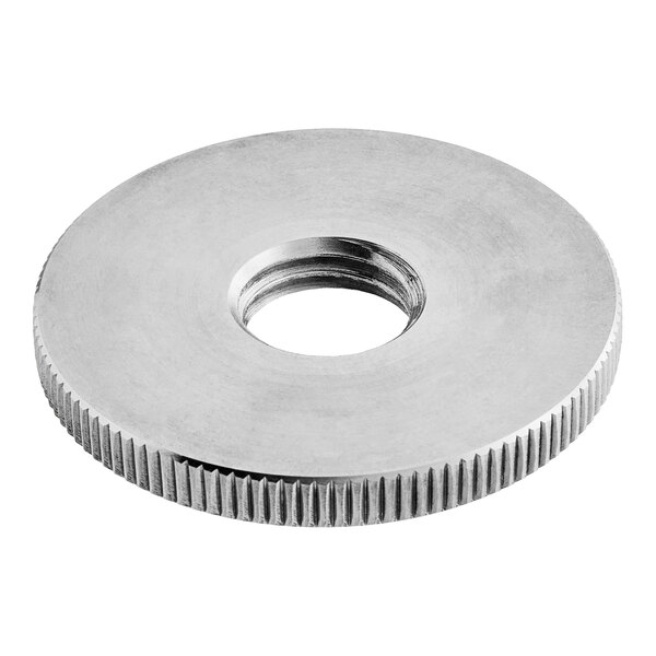 A silver stainless steel circular nut with a hole in the middle.
