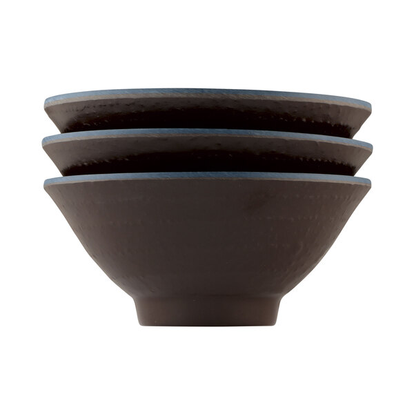 A stack of Elite Global Solutions Pebble Creek Lapis-colored bowls with blue rims.