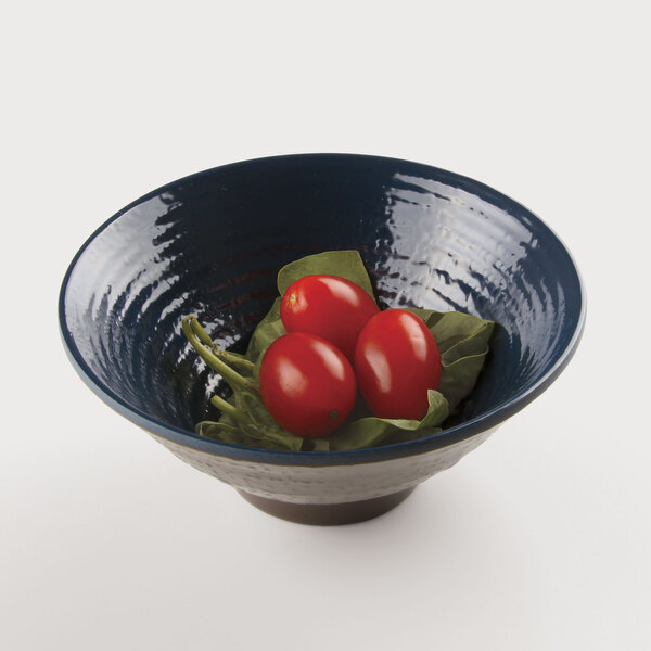 A Elite Global Solutions Pebble Creek lapis-colored melamine bowl with tomatoes on leaves.