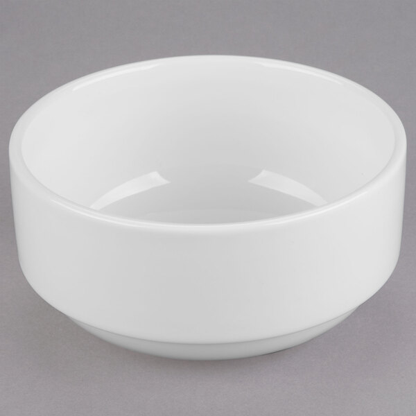 A white Libbey porcelain bouillon bowl with a lid on a gray surface.