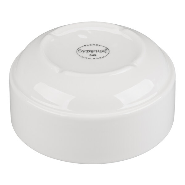 A white porcelain bouillon cup with a stacking design, shown upside down.