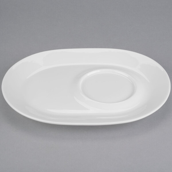 A white plate with a round center and oval rim.