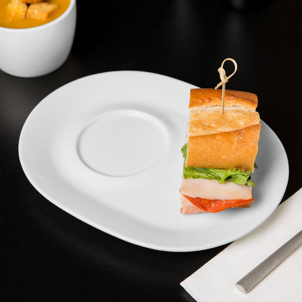 A sandwich on a Libbey white porcelain racetrack plate.