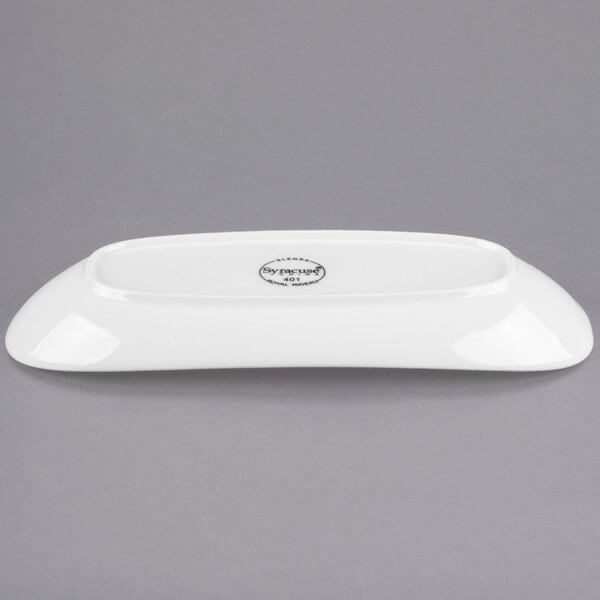 A white rectangular Libbey porcelain plate with a circular design on it.