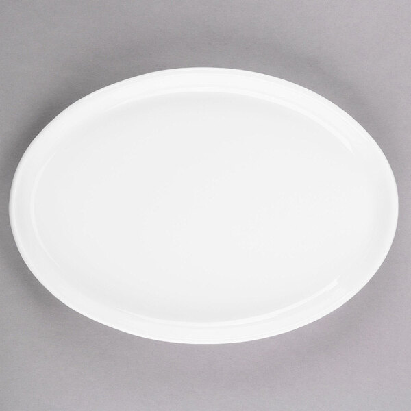 A white Libbey oval porcelain tray with a white rim.