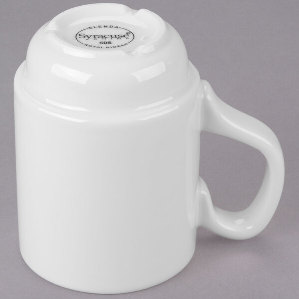 A close-up of a white Libbey Slenda stacking porcelain mug with a handle.