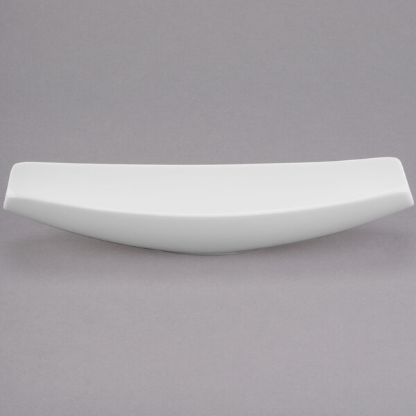 A white rectangular Libbey canoe plate on a gray surface.