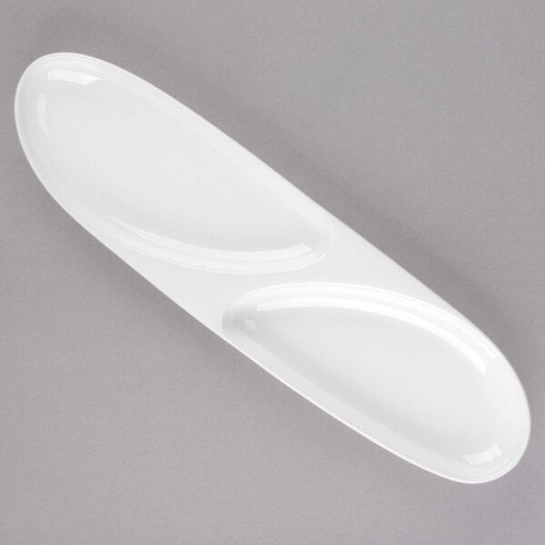 A white oval porcelain serving tray with two oval wells.