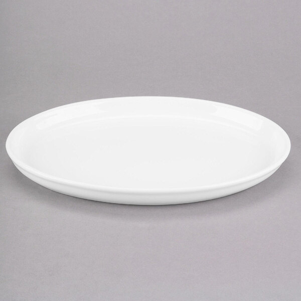 A Libbey white porcelain tray with a rim on a gray surface.