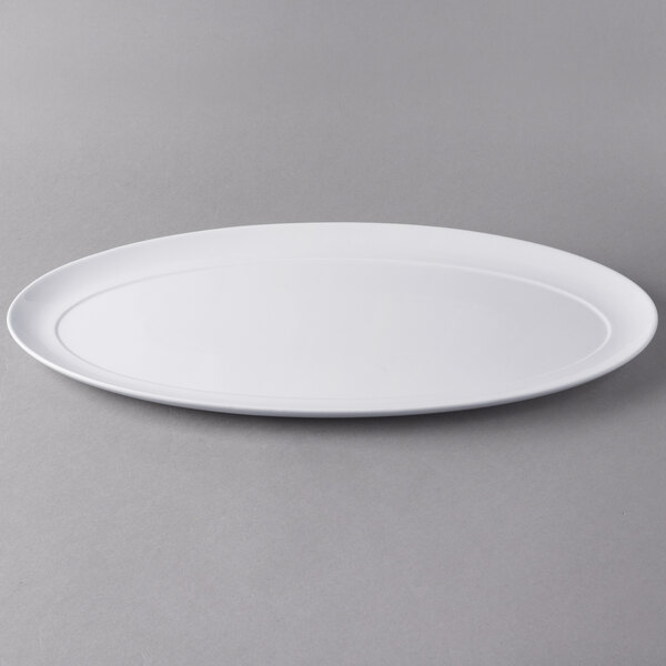 A white Libbey oval porcelain tray.