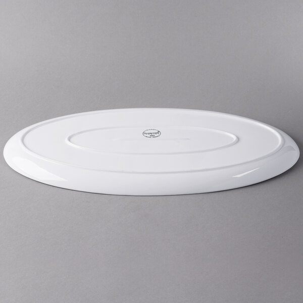 A white Libbey oval porcelain tray with a logo.