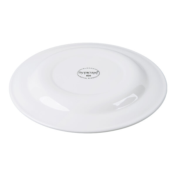 A white round plate shown upside down with a logo and text in the center.