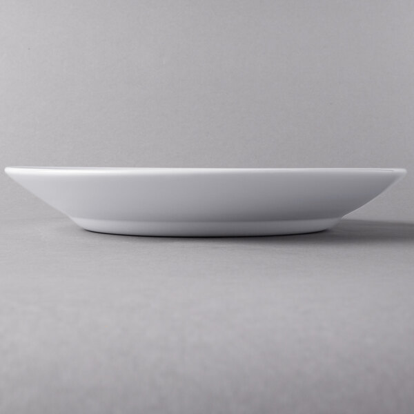 A close up of a white Libbey Slenda Royal Rideau entree and pasta bowl.