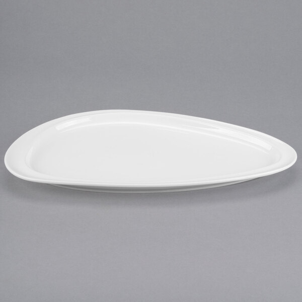 A white Libbey Slenda Triform Royal Rideau porcelain plate with an oval shape and white rim.