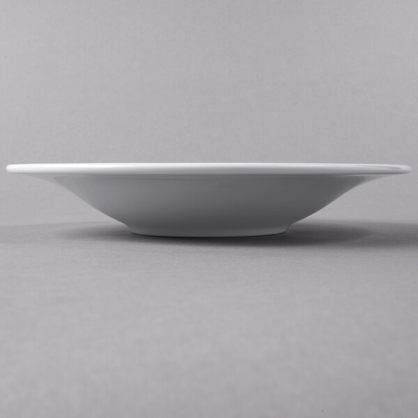 A white Libbey Royal Rideau coupe bowl on a grey surface.