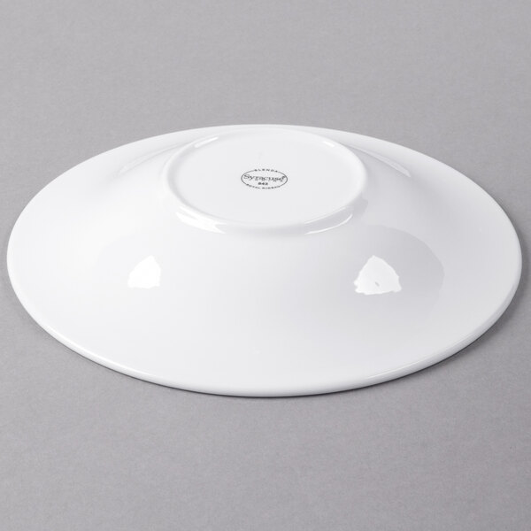 A Libbey Royal Rideau white porcelain bowl on a gray surface.