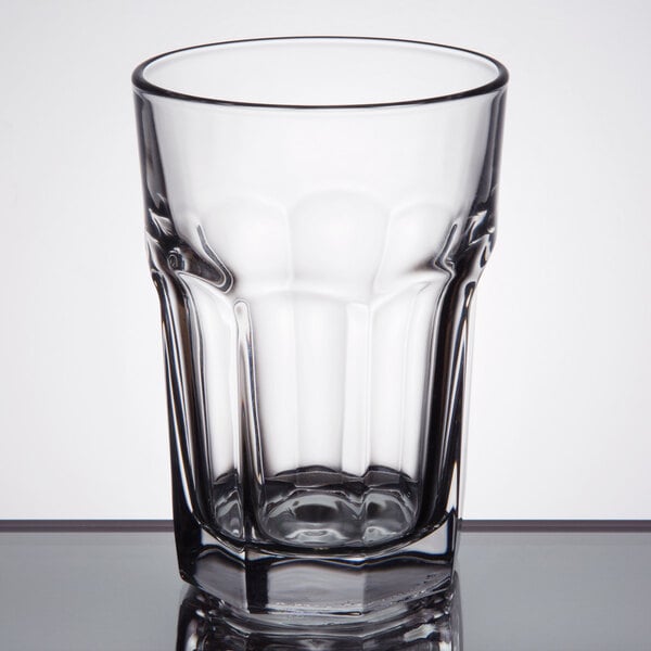 A close up of a Libbey Gibraltar beverage glass full of water on a table.