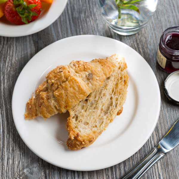 A croissant on a Libbey Royal Rideau medium rim porcelain plate.