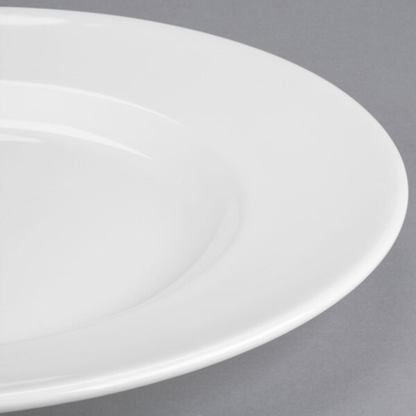 A Libbey white porcelain plate with a wide rim.